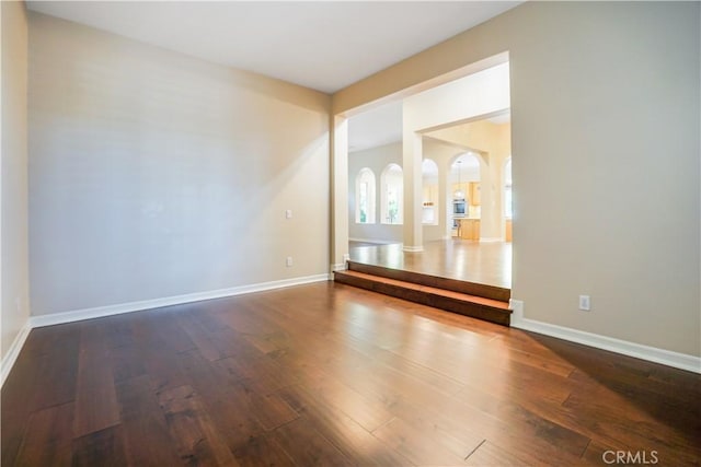 12160 Glines Ct, Tustin, CA 92782 - unfurnished room with wood finished floors and arched walkways