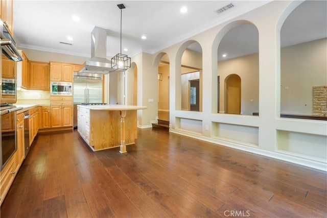 12160 Glines Ct, Tustin, CA 92782 - kitchen featuring wall chimney exhaust hood, appliances with stainless steel finishes, a center island, light countertops, and ornamental molding
