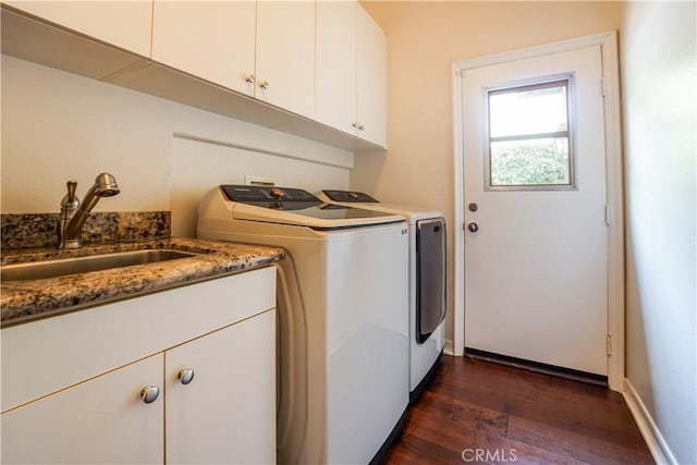 12160 Glines Ct, Tustin, CA 92782 - washroom with dark wood-style floors, cabinet space, and washing machine and clothes dryer