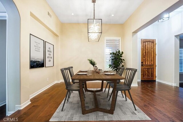12160 Glines Ct, Tustin, CA 92782 - dining room with wood finished floors, arched walkways, recessed lighting, and a chandelier