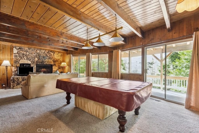 27495 Cedarwood Dr, Lake Arrowhead, CA 92352 - rec room with carpet floors, pool table, wooden ceiling with exposed beams, a fireplace, and wood walls