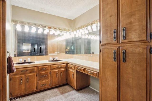 27495 Cedarwood Dr, Lake Arrowhead, CA 92352 - full bathroom featuring double vanity and a textured ceiling