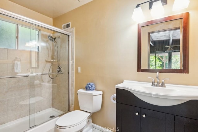 27495 Cedarwood Dr, Lake Arrowhead, CA 92352 - bathroom with toilet, vanity, and a stall shower