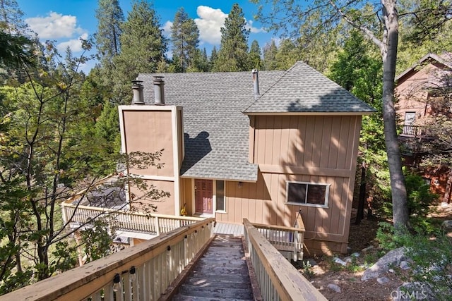 27495 Cedarwood Dr, Lake Arrowhead, CA 92352 - back of house with a shingled roof and a chimney