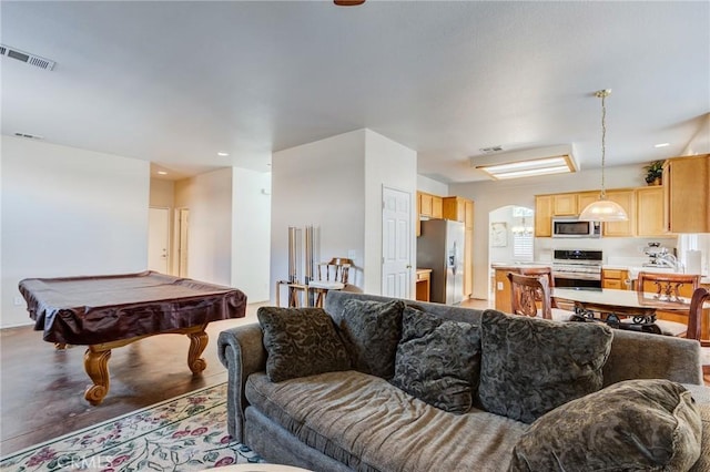 8961 Newcastle Ave, Hesperia, CA 92344 - living room with arched walkways, pool table, and recessed lighting