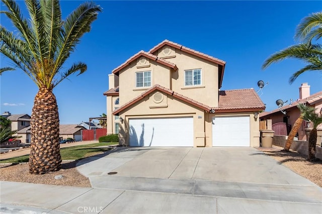 8961 Newcastle Ave, Hesperia, CA 92344 - mediterranean / spanish-style house with stucco siding, driveway, an attached garage, and a tile roof