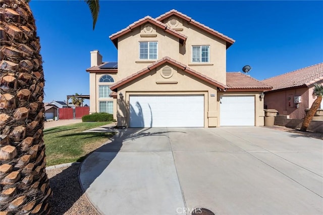 8961 Newcastle Ave, Hesperia, CA 92344 - view of front of home with stucco siding, an attached garage, concrete driveway, a tiled roof, and a chimney