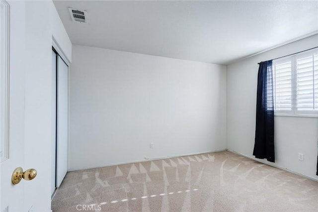 8961 Newcastle Ave, Hesperia, CA 92344 - unfurnished bedroom with carpet floors and a closet