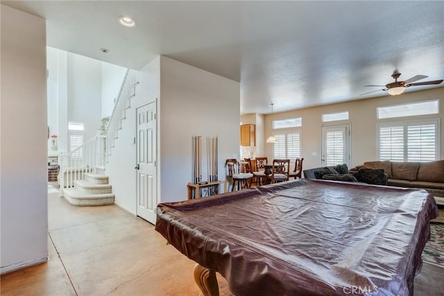8961 Newcastle Ave, Hesperia, CA 92344 - recreation room with concrete floors, a ceiling fan, and recessed lighting
