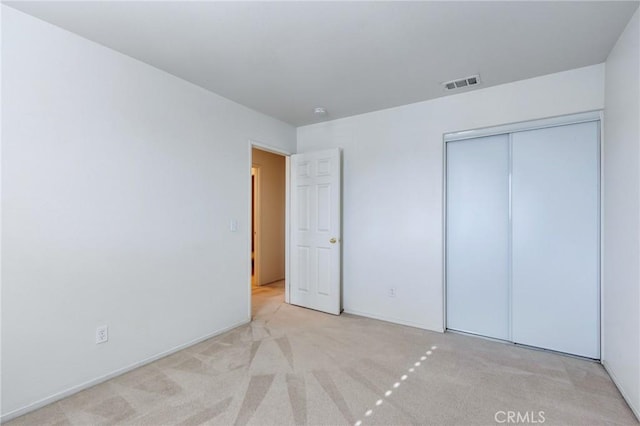 8961 Newcastle Ave, Hesperia, CA 92344 - unfurnished bedroom with carpet floors, a closet, and baseboards