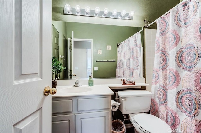 8961 Newcastle Ave, Hesperia, CA 92344 - full bathroom with vanity, toilet, and a shower with shower curtain