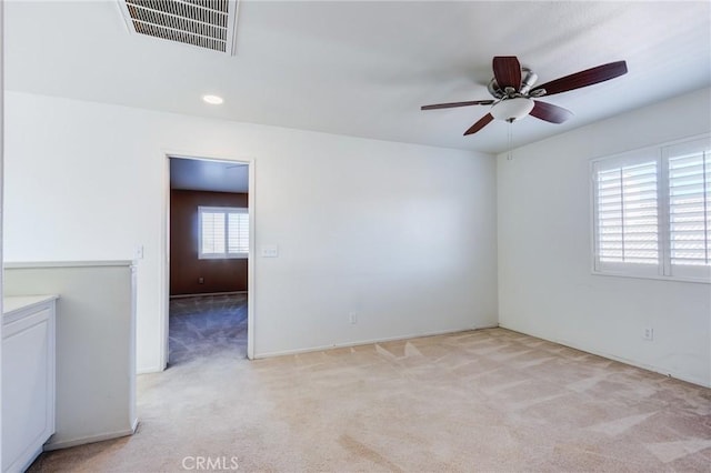 8961 Newcastle Ave, Hesperia, CA 92344 - empty room with light carpet and a ceiling fan