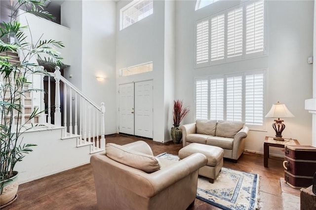 8961 Newcastle Ave, Hesperia, CA 92344 - living room featuring a towering ceiling and stairway