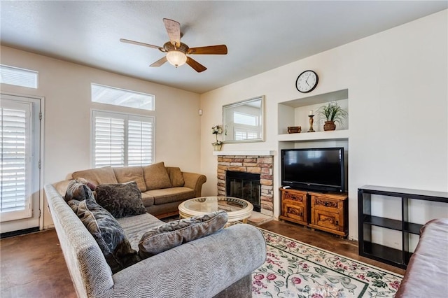 8961 Newcastle Ave, Hesperia, CA 92344 - living area featuring a ceiling fan and a fireplace