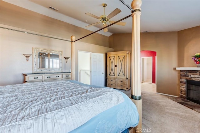 8961 Newcastle Ave, Hesperia, CA 92344 - carpeted bedroom with a stone fireplace, ceiling fan, and a towering ceiling