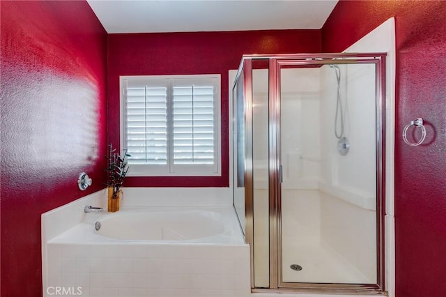 8961 Newcastle Ave, Hesperia, CA 92344 - bathroom featuring a stall shower, a garden tub, and a textured wall