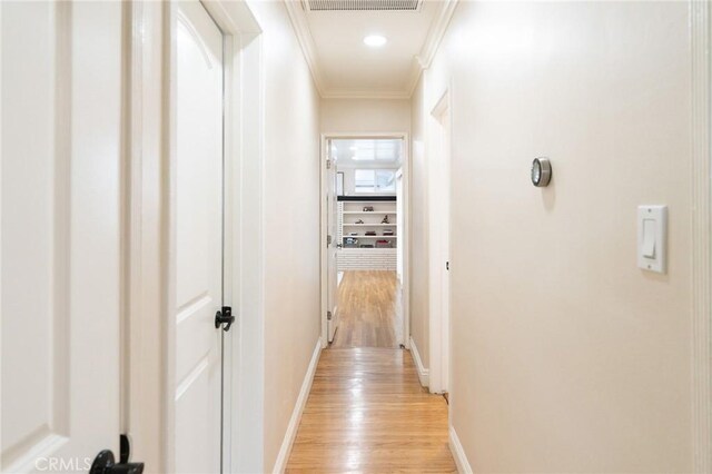 6003 Eastbrook Ave, Lakewood, CA 90713 - hall featuring light wood finished floors and ornamental molding