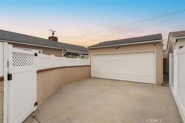 6003 Eastbrook Ave, Lakewood, CA 90713 - garage at dusk with a detached garage