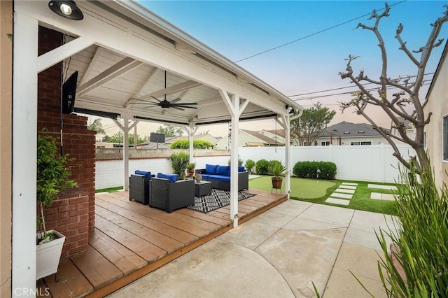 6003 Eastbrook Ave, Lakewood, CA 90713 - fenced backyard with an outdoor living space, ceiling fan, a wooden deck, and a patio area