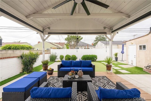 6003 Eastbrook Ave, Lakewood, CA 90713 - fenced backyard featuring an outdoor hangout area, ceiling fan, a gazebo, and a patio area