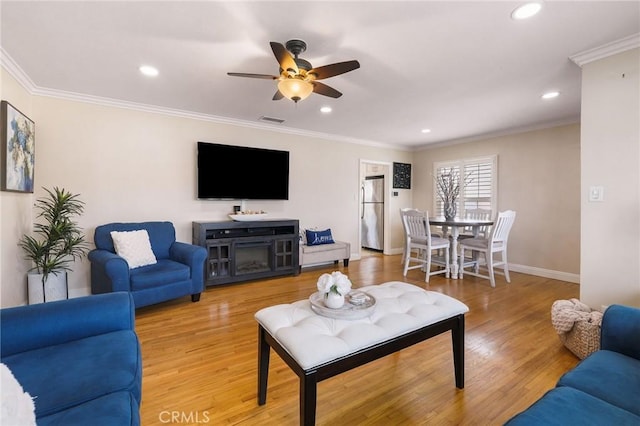 6003 Eastbrook Ave, Lakewood, CA 90713 - living area featuring ceiling fan, recessed lighting, ornamental molding, and light wood-style flooring