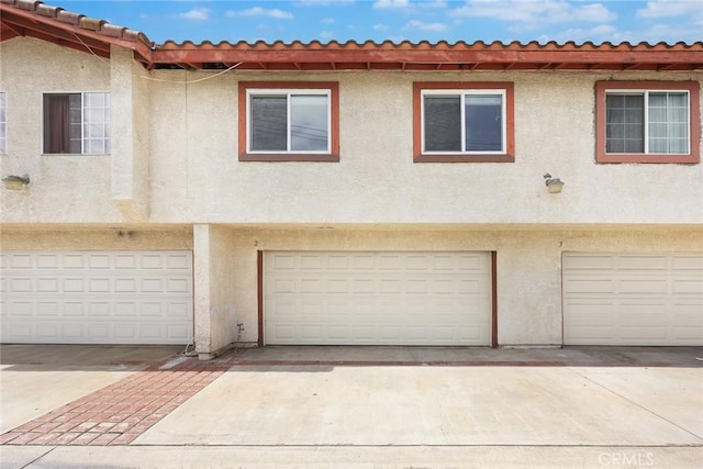 915 Carob Way Unit 2, Montebello, CA 90640 - view of front of house featuring a garage and stucco siding