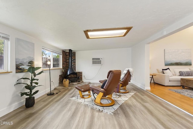 2791 Elizondo Ave, Simi Valley, CA 93065 - living area with a wood stove, wood finished floors, and plenty of natural light