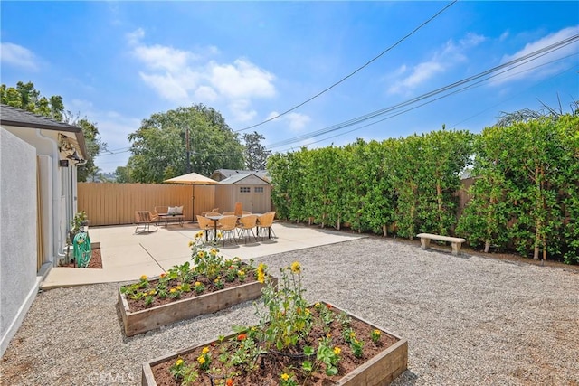 2482 New York Dr, Altadena, CA 91001 - fenced backyard with a vegetable garden and a patio area