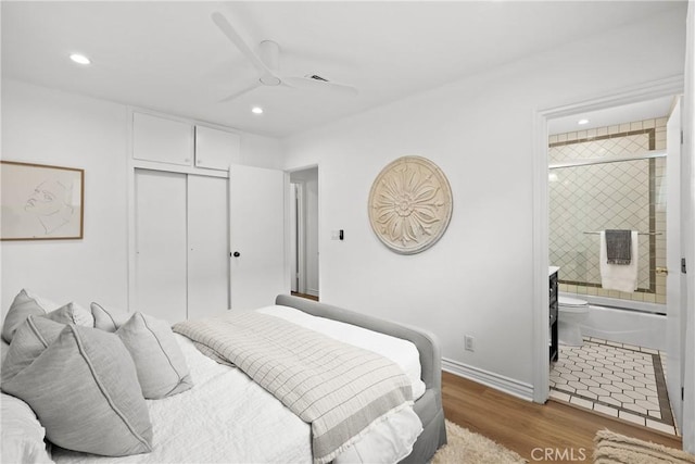2482 New York Dr, Altadena, CA 91001 - bedroom featuring wood finished floors, recessed lighting, a closet, ensuite bath, and baseboards
