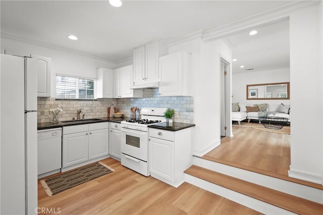 2482 New York Dr, Altadena, CA 91001 - kitchen featuring white appliances, a sink, dark countertops, crown molding, and white cabinetry
