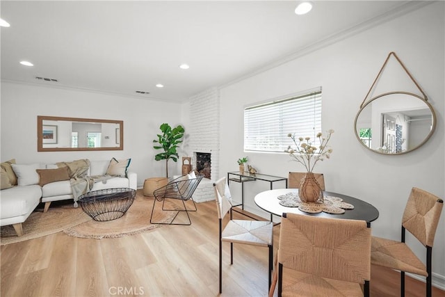 2482 New York Dr, Altadena, CA 91001 - dining space featuring ornamental molding, wood finished floors, recessed lighting, and a fireplace