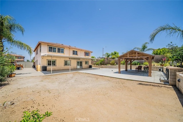 18427 Blue Sky St, Riverside, CA 92508 - rear view of house featuring a gazebo, stucco siding, and a patio area