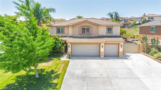 18427 Blue Sky St, Riverside, CA 92508 - mediterranean / spanish-style home with a garage, stucco siding, a tile roof, concrete driveway, and a gate