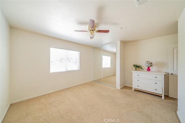 18427 Blue Sky St, Riverside, CA 92508 - unfurnished bedroom featuring light carpet, ceiling fan, baseboards, and a closet