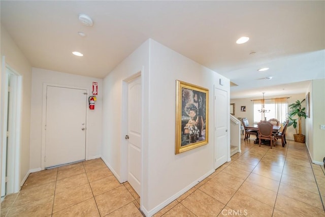18427 Blue Sky St, Riverside, CA 92508 - hall with light tile patterned floors, recessed lighting, and baseboards
