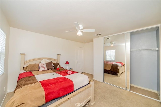 18427 Blue Sky St, Riverside, CA 92508 - bedroom featuring light carpet, ceiling fan, baseboards, and a closet