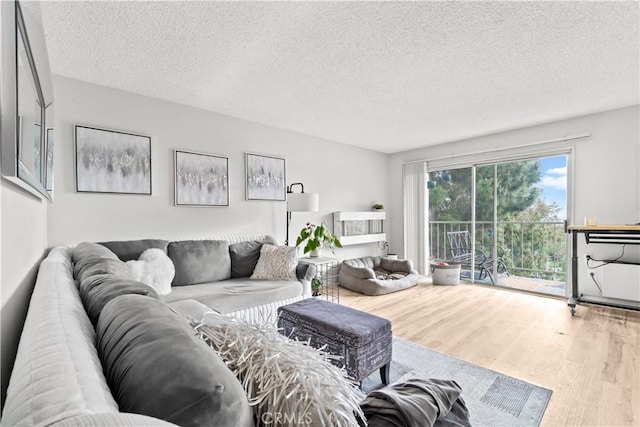 5369 Algarrobo Unit 3F, Laguna Woods, CA 92637 - living room with wood finished floors and a textured ceiling