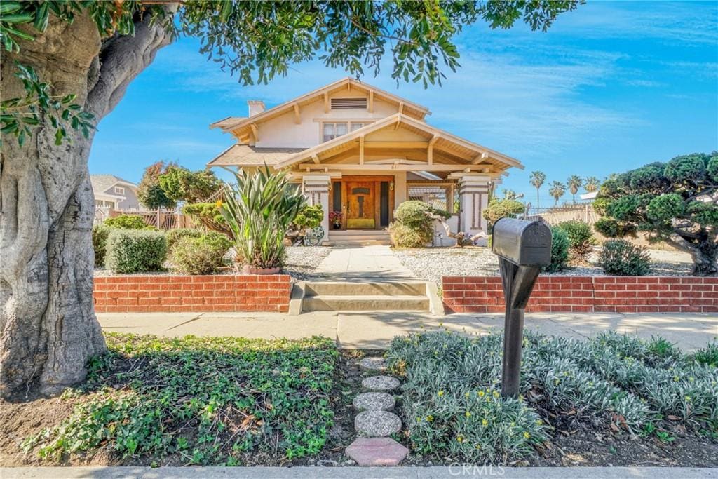 611 W 124th St, Los Angeles, CA 90044 - craftsman inspired home with a chimney and covered porch