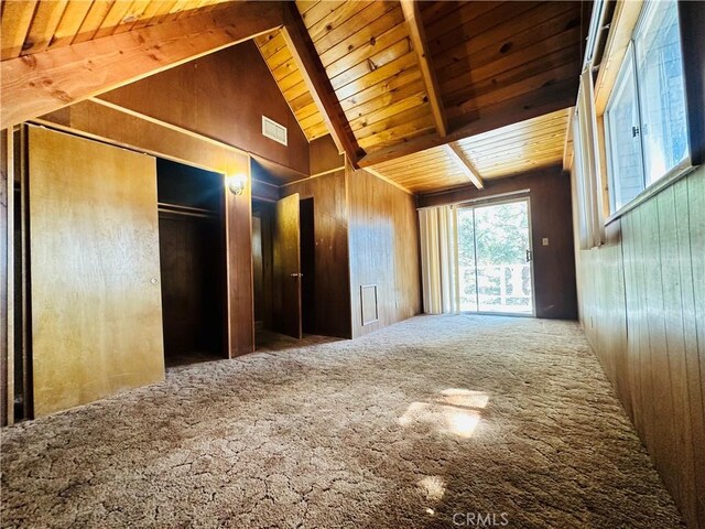 31506 Circle View Dr, Running Springs, CA 92382 - carpeted spare room featuring wooden ceiling with exposed beams, wooden walls, and high vaulted ceiling