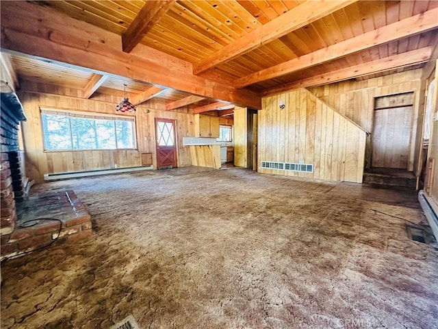 31506 Circle View Dr, Running Springs, CA 92382 - unfurnished living room with wood walls, a baseboard radiator, wood ceiling with exposed beams, plenty of natural light, and carpet floors