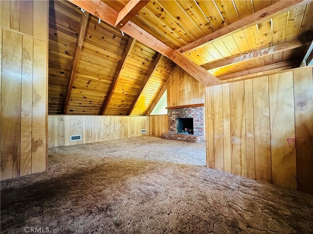 31506 Circle View Dr, Running Springs, CA 92382 - unfurnished living room featuring wood ceiling, wood walls, carpet floors, and a fireplace
