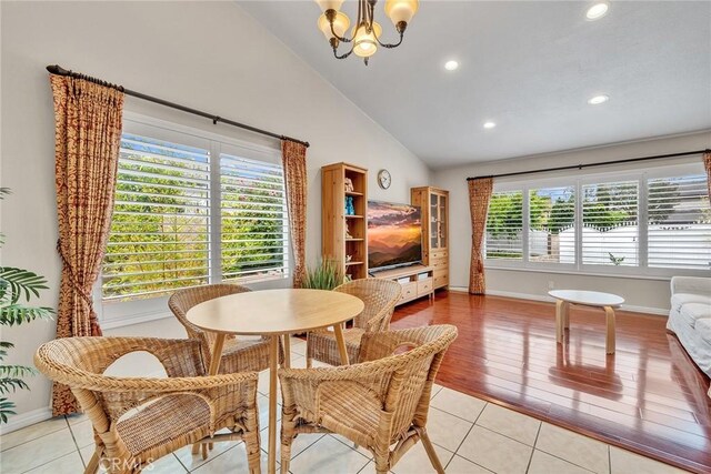 19545 Quicksilver Ln, Rowland Heights, CA 91748 - dining space featuring a chandelier, light tile patterned floors, recessed lighting, baseboards, and high vaulted ceiling