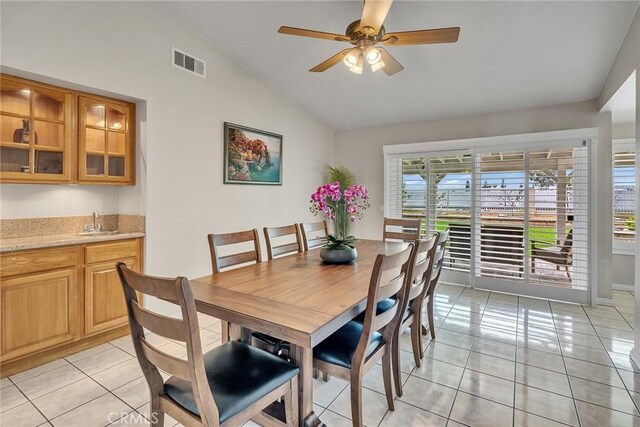 19545 Quicksilver Ln, Rowland Heights, CA 91748 - dining space with lofted ceiling, light tile patterned floors, wet bar, a ceiling fan, and baseboards