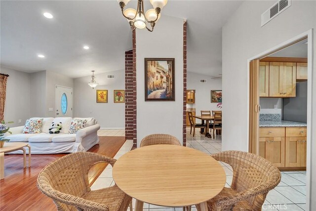 19545 Quicksilver Ln, Rowland Heights, CA 91748 - dining space with recessed lighting, a chandelier, lofted ceiling, and light tile patterned floors