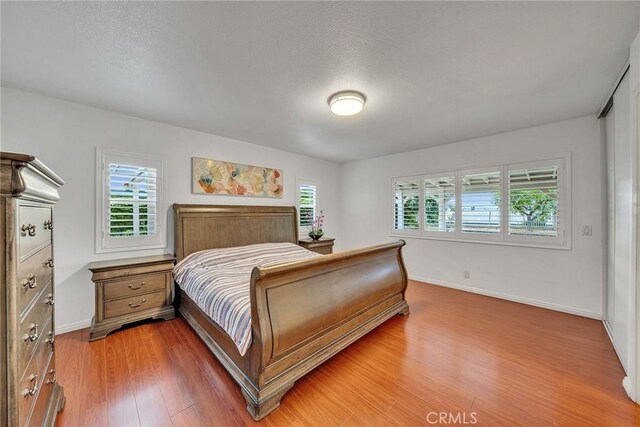 19545 Quicksilver Ln, Rowland Heights, CA 91748 - bedroom featuring light wood-type flooring and baseboards