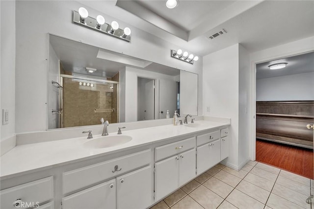 19545 Quicksilver Ln, Rowland Heights, CA 91748 - full bathroom with double vanity, a stall shower, and tile patterned flooring