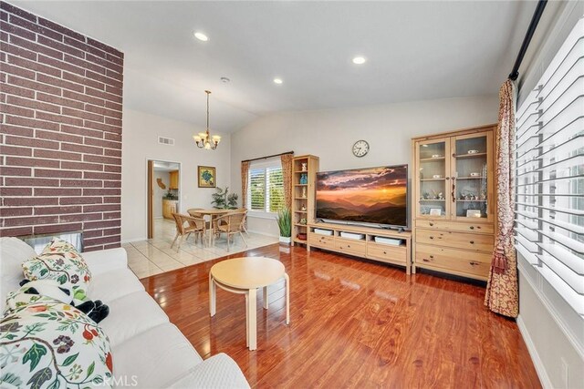19545 Quicksilver Ln, Rowland Heights, CA 91748 - living area with a chandelier, lofted ceiling, wood finished floors, baseboards, and recessed lighting