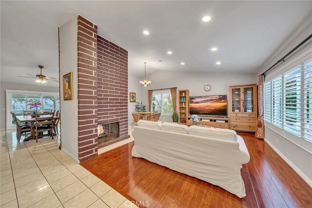 19545 Quicksilver Ln, Rowland Heights, CA 91748 - living room featuring plenty of natural light, vaulted ceiling, recessed lighting, a chandelier, and baseboards