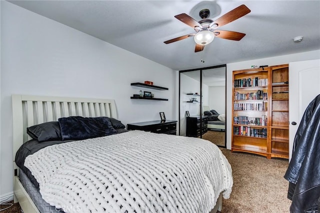 18016 Mariner Dr, Victorville, CA 92395 - bedroom featuring dark carpet, a closet, and ceiling fan