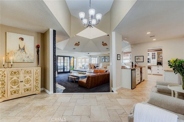 18016 Mariner Dr, Victorville, CA 92395 - living area with a chandelier, stone tile floors, and baseboards